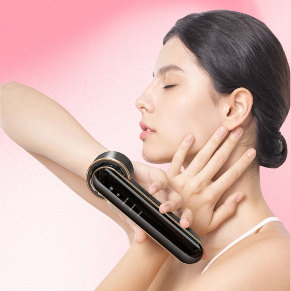 Confident woman posing with the Dainty Dewy skincare device in hand