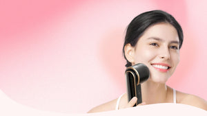 Smiling woman using Dainty Dewy skincare device during her beauty routine
